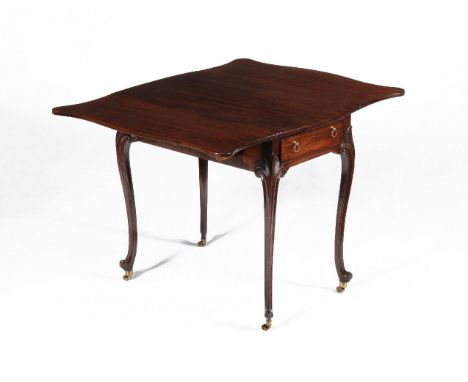 A George III mahogany 'butterfly' Pembroke table, attributed to Thomas Chippendale, circa 1770, the shaped top incorporating 