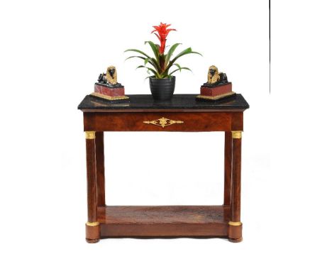 A Louis Philippe mahogany and gilt metal mounted console table, circa 1840, the rectangular black marble top above the gilt m