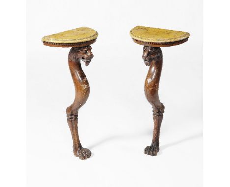 A pair of Regency pine and simulated marble console tables, circa 1815, each D shaped simulated marble top with a moulded edg