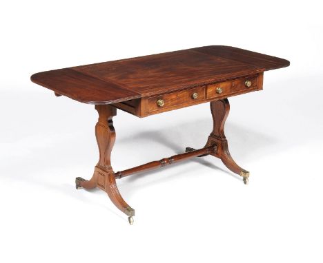 A Regency mahogany sofa table, circa 1815, the rectangular top incorporating a pair of D-shaped hinged leaves, above pair of 