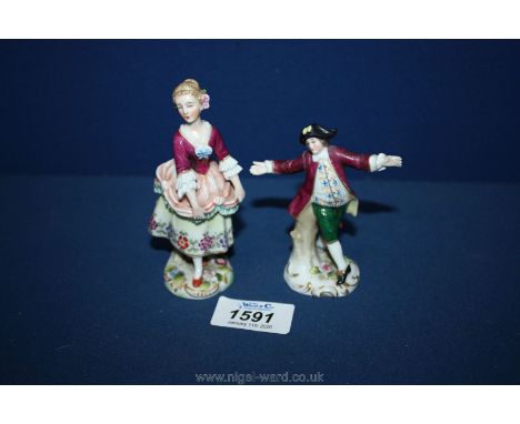 A pair of miniature Regency dressed figures of Sampson Paris, one marked Nao.