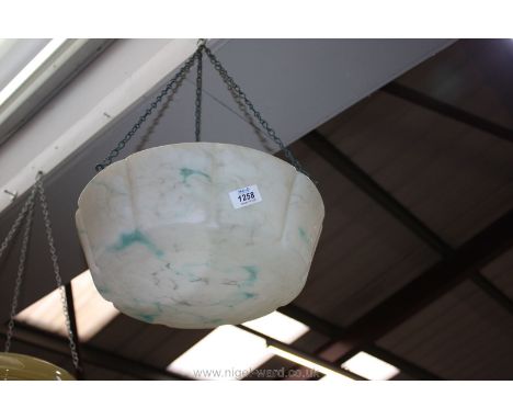 A large 1950's hanging glass light shade with blue marble effect.