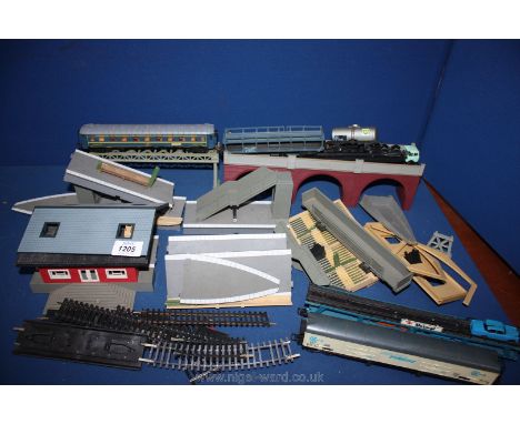 A quantity of model train parts, railway track, bridges, cargo trains, etc., made in Italy.