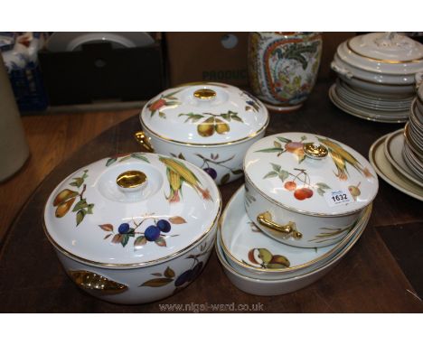 A quantity of mixed Royal Worcester Evesham three vegetable tureens with lids and two oval dishes.