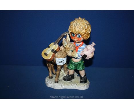 A large Goebel figure of a boy and donkey, 8 1/2" tall, Michel T signature.