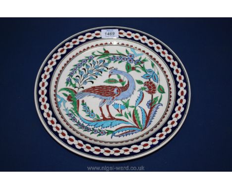 A Turkish ceramic charger hand painted Peacock with flowers, approx. 12.5".