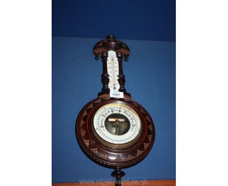 An aneroid Banjo Barometer and thermometer.