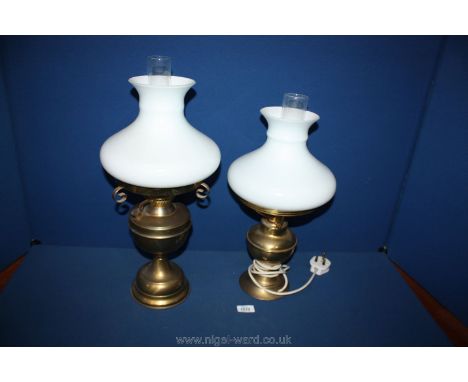 A Brass oil Lamp with white glass shade and another similar converted to electric.