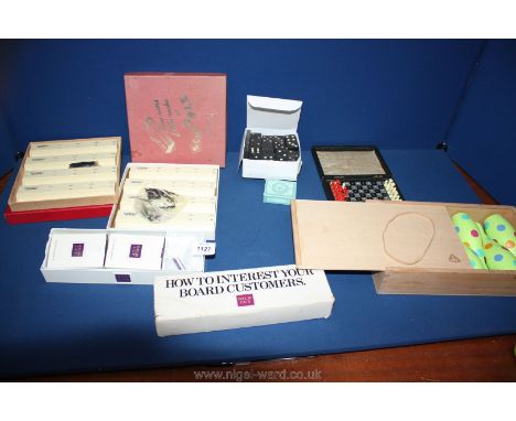 A quantity of miscellaneous games including dominoes, Scrabble letter racks, silk cut cigarettes cribbage board, etc.,