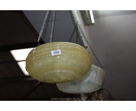 A 1950's hanging glass light shade in dome form with a cream marble effect.