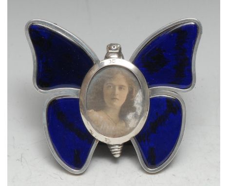 A Victorian silver and enamel novelty easel photograph frame, as a butterfly, oval aperture, 11.5cm wide, Henry Stuart Brown,