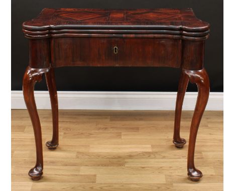 An early George III rosewood and parquetry 'double' card table, hipped rectangular top enclosing two tooled and gilt leather 