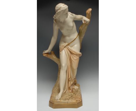 A Royal Worcester figure, modelled by Sir Thomas Brock, The Bather Surprised, she stands scantilly draped, by a tree stump,  