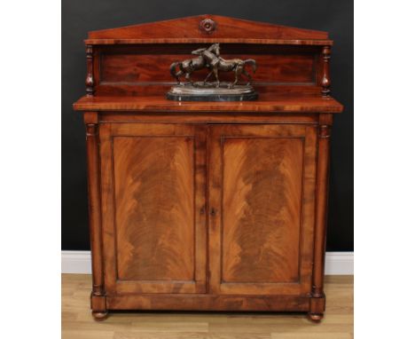 A Victorian mahogany chiffonier, the arched superstructure with shaped shelf, turned supports, rectangular top above a pair o