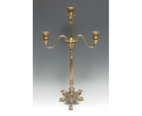 A post-Regency brass three light tripod candelabrum, bell shaped sconces, cast with lotus, reeded column, cabriole legs, anth