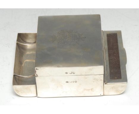 An unusual Victorian silver gentleman's smoking compendium, the central cigarette box with hinged cover above vesta compartme