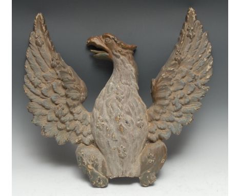 A 19th century cast iron architectural applique, cast as a spread eagle crest, 51cm wide 