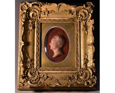 A 19th century wax portrait, of a gentleman, in profile facing to dexter, 7cm x 5cm, inscribed to verso in ink manuscript: Di