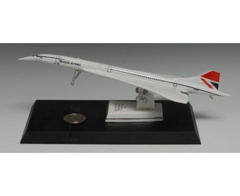 A Royal Worcester model, The First Flight of Concorde, 21st January 1976, mounted on black base , set with Commemorative Conc