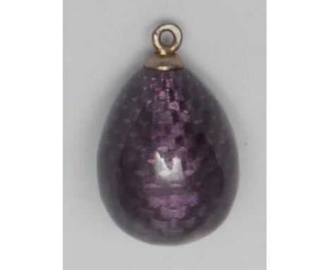 An early 20th century puce guilloche enamel egg shaped pendant, possibly Russian, 2cm over loop 