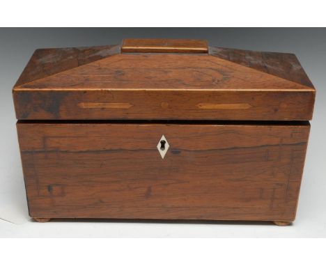 A George IV rosewood sarcophagus tea caddy, hinged cover enclosing a pair of canisters and a glass bowl, inlaid and strung th