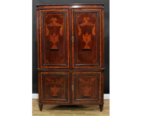 A 19th century Dutch mahogany and marquetry floor standing corner cabinet, shallow moulded cornice above a pair of panel door