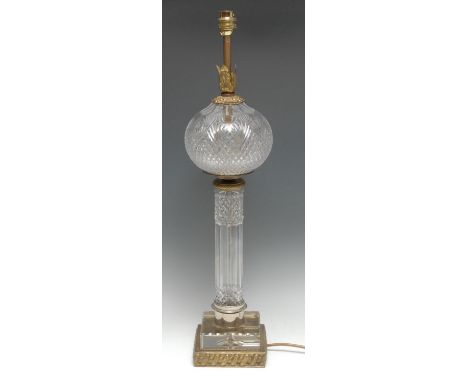Interior Decoration - a cut glass and brass table lamp, ovoid 'reservoir', faceted pillar, square base, 63cm high 
