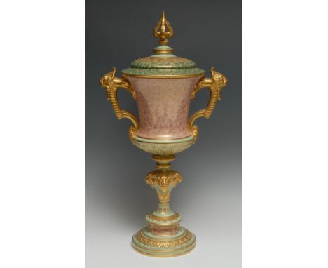 A Coalport chalice vase and cover, the thistle shaped cup in mottled pick with two gilt mask and scroll handle, lion mask kno