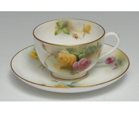 A Royal Worcester teacup and saucer, painted with pink and yellow roses on a mottled green ground, gilt line rims, the saucer
