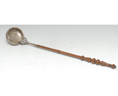 A William IV/early Victorian Scottish silver punch ladle, the bowl chased with stiff leaves, flowers and scrolling foliage, t