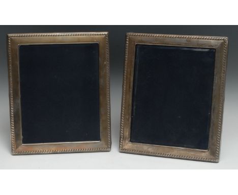 A pair of large Elizabeth II silver rectangular easel photograph frames, gadrooned borders, 31cm high, R Carr, Sheffield 1990