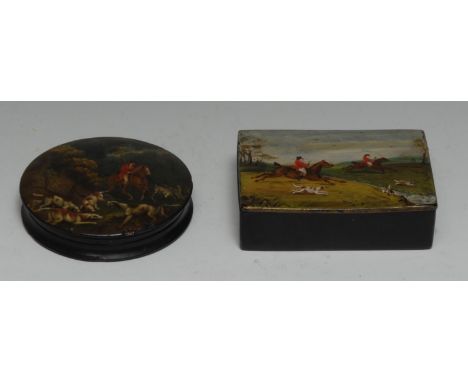 A 19th century papier mache circular snuff box, the cover painted with a fox hunting scene, 10.5cm diameter; another, rectang