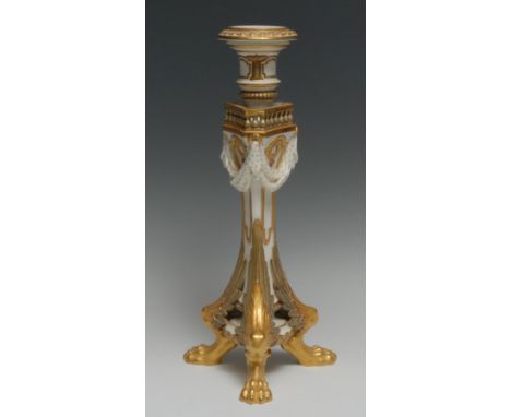 A Royal Worcester candlestick, beaded nozzles, reel sconce, triform column with balustrade, bold winged lion paw feet, 31cm h