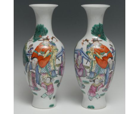 A pair of Chinese porcelain baluster vases, painted in polychrome enamels with traditional figures of rank in a stylized gard