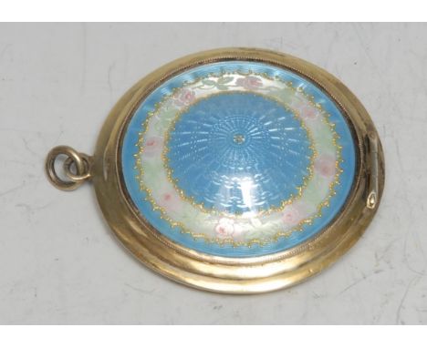 An early 20th century silver-gilt and enamel rouge box, hinged cover decorated in tones of pale blue and outlined with a band