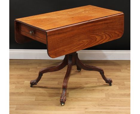 An unusual Regency mahogany pembroke table, possibly Scottish, rounded rectangular top with fall leaves, above a frieze drawe