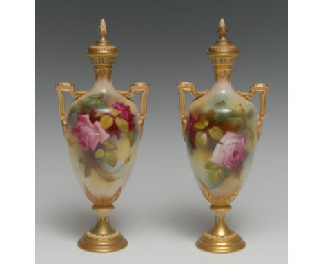 A pair of Royal Worcester pedestal ovoid vases and covers, painted with pink roses on a mottled ground, spiked bud finials, t