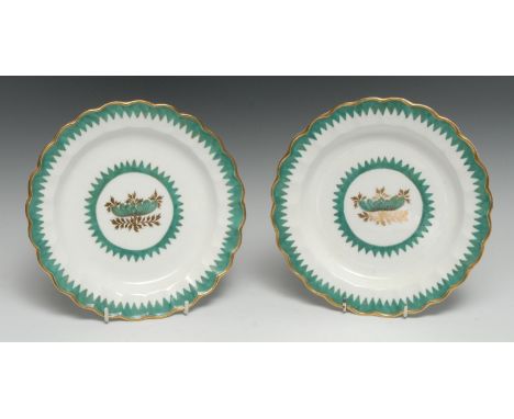 A pair of Worcester shaped circular plates, painted in famille verte enamels and gilt with a peony and leafy foliage within d