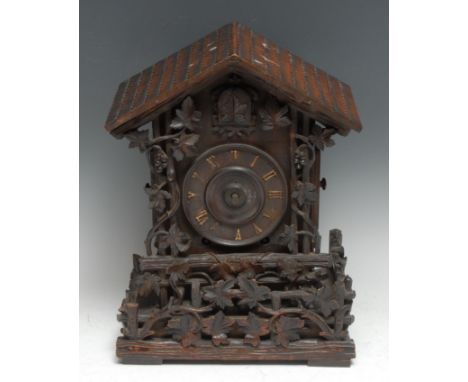 A Black Forest mantel cuckoo clock, 11cm dial applied with Roman numerals, eight-day movement, the architectural 'chalet' cas
