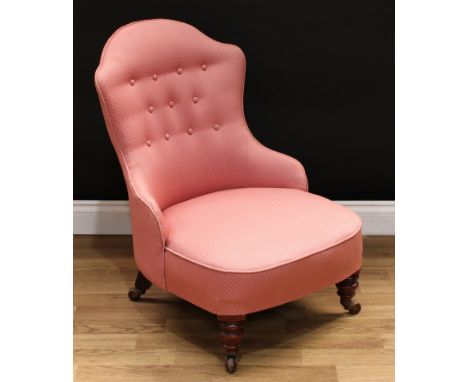A Victorian mahogany nursing chair, shaped back, deep-buttoned stuffed over upholstery, turned legs, ceramic casters, 79cm hi