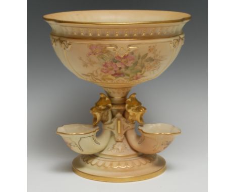 A Royal Worcester table centrepiece, the rounded bowl printed and painted with flowers and folagie on a blush ivory ground,  