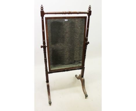 Regency mahogany swing frame cheval mirror, each with original rectangular mirror plate in ring turned frame on splayed cabri