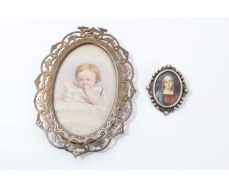 Edwardian portrait miniature of a young child, oval, in pierced silvered frame, 12cm x 8cm, together with 19th century religi