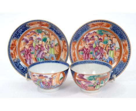 Pair of 18th century Chinese export tea bowls and saucers with Mandarin palette figure reserves, circa 1770