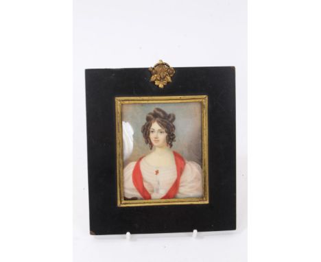 English School, circa 1830, miniature portrait on ivory of a lady with white dress and scarlet sash, 8.5 x 7cm, glazed papier