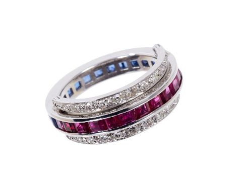 Diamond, sapphire and ruby eternity ring, the central band with a continuous line of channel set square cut rubies and blue s