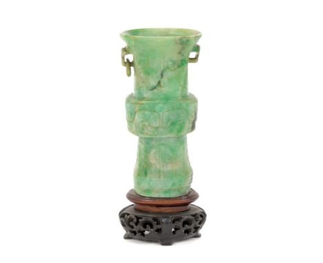 18th / 19th century Chinese carved spinach jade of a Gu-form vessel, carved in low relief with taote masks, 7.5cm high, on ca