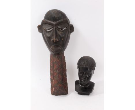 Madagascan carved ebony bust, signed Antandroy (people of the thorn bush) R. Raharisoh, 18cm high, together with an African m