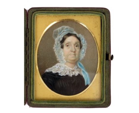 English School, circa 1830, portrait of a lady with lace bonnet, oval, 7.5cm, glazed red leather folding case