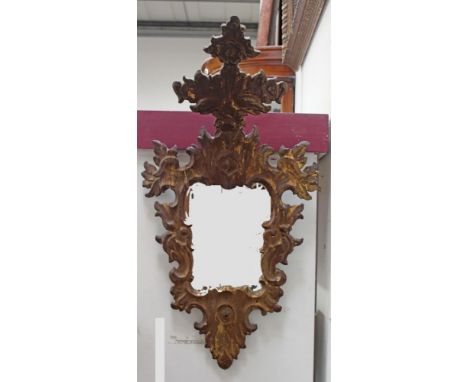 18th / 19th century Continental gilt wall mirror, with cartouche shaped plate within elaborate scrolling rococo acanthus fram